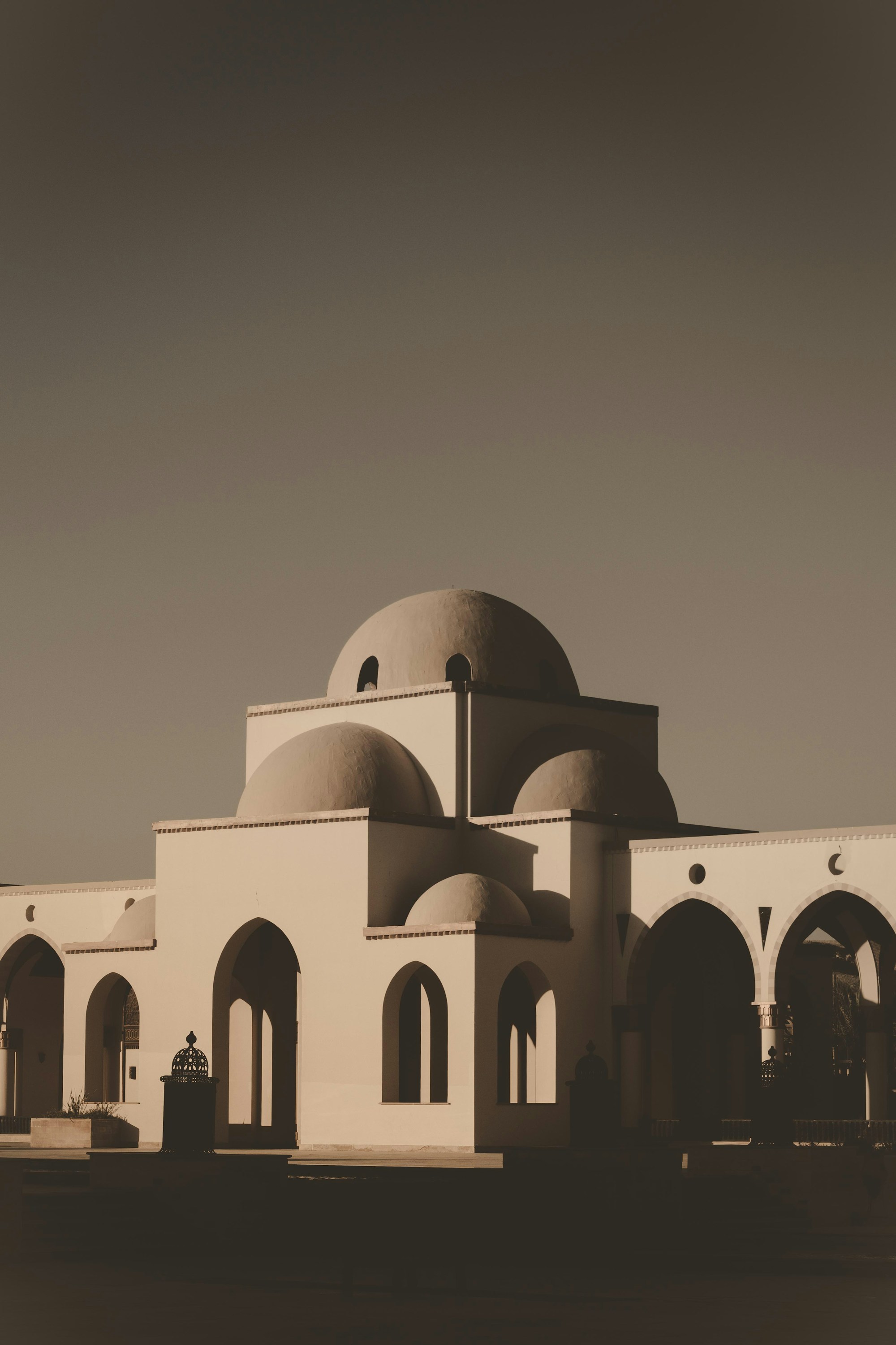 Old-world fort and domes in desert light